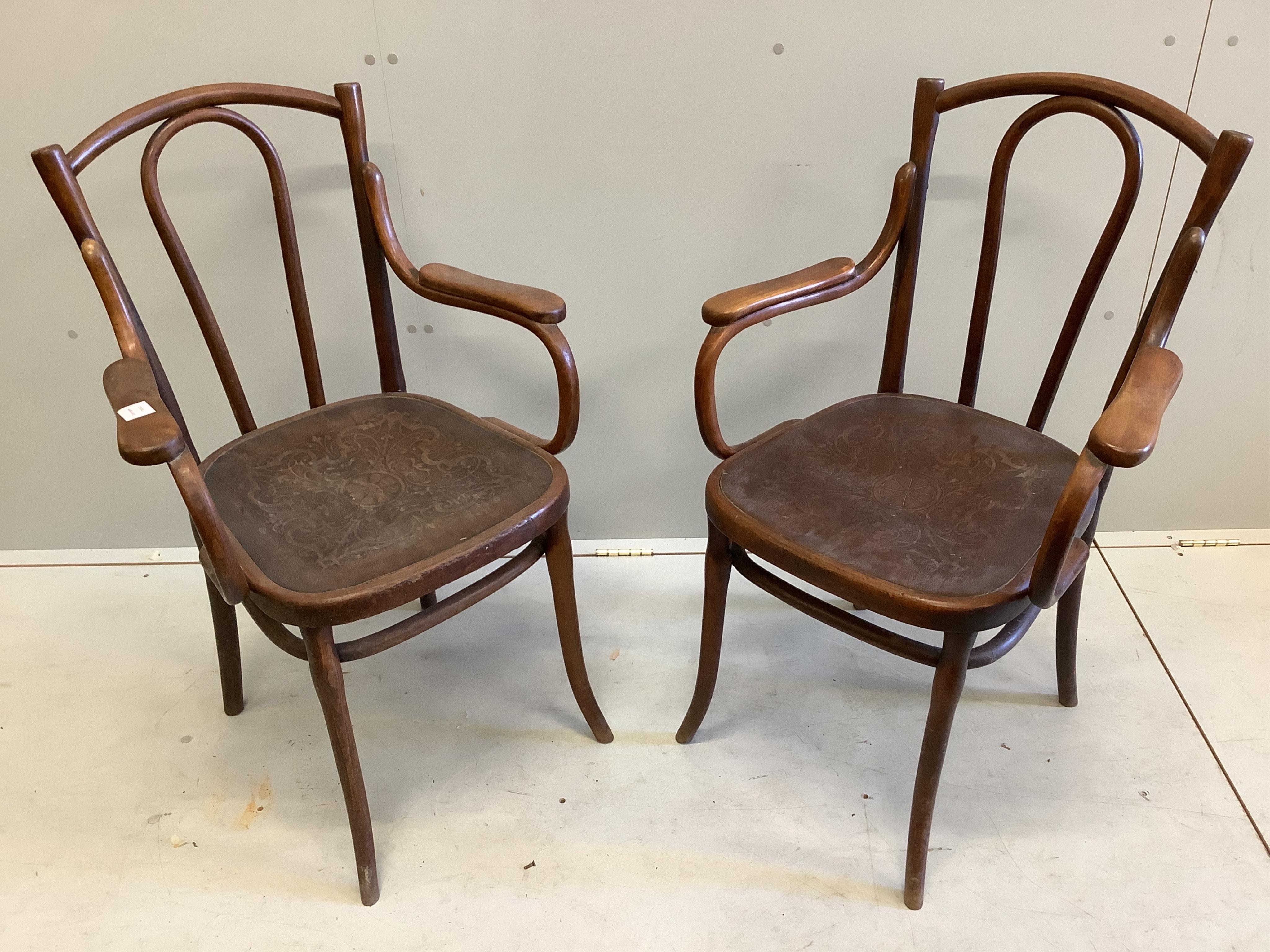 A pair of Thonet style bentwood elbow chairs, width 58cm, depth 56cm, height 92cm